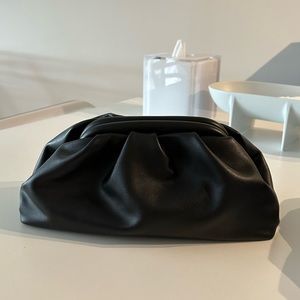 Black dumpling pouch bag clutch